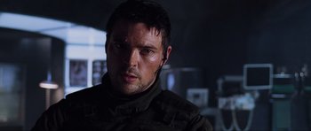 Movie still from “Doom” (2005), directed by Andrzej Bartkowiak – A person wearing a jacket; Close Up shot, Over the shoulder angle