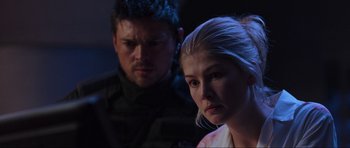 Movie still from “Doom” (2005), directed by Andrzej Bartkowiak – A man and a woman in a dark room; Close Up shot, Over the shoulder angle