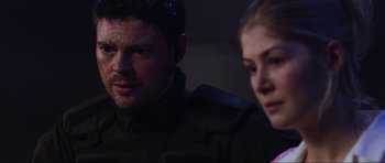 Movie still from “Doom” (2005), directed by Andrzej Bartkowiak – A man and a woman are looking at the camera; Close Up shot, Over the shoulder angle
