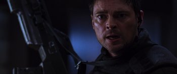 Movie still from “Doom” (2005), directed by Andrzej Bartkowiak – A person holding an umbrella; Close Up shot, Low angle