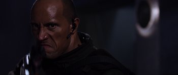 Movie still from “Doom” (2005), directed by Andrzej Bartkowiak – A person wearing a headset; Close Up shot, Low angle