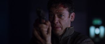 Movie still from “Doom” (2005), directed by Andrzej Bartkowiak – A person holding a gun; Close Up shot, Low angle