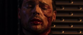 Movie still from “Doom” (2005), directed by Andrzej Bartkowiak – A person with blood all over his face; Close Up shot, Overhead angle