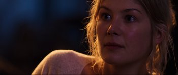 Movie still from “Doom” (2005), directed by Andrzej Bartkowiak – A woman's face in the dark; Close Up shot, Over the shoulder angle