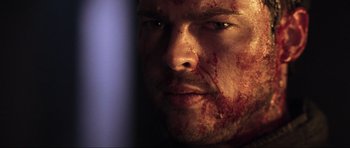 Movie still from “Doom” (2005), directed by Andrzej Bartkowiak – A person with blood all over his face; Close Up shot, Low angle