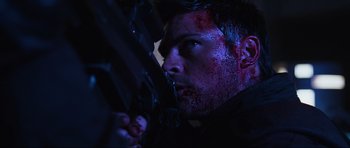 Movie still from “Doom” (2005), directed by Andrzej Bartkowiak – A person with blood on his face; Close Up shot, Low angle