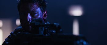 Movie still from “Doom” (2005), directed by Andrzej Bartkowiak – A person in a dark room; Close Up shot, Low angle