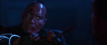 Movie still from “Doom” (2005), directed by Andrzej Bartkowiak – A person with a knife in his hand; Close Up shot, Low angle