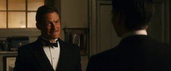 Movie still from “Downton Abbey: A New Era” (2022), directed by Simon Curtis – A man in a tuxedo looking at himself in the mirror; Close Up shot, Over the shoulder angle