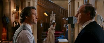 Movie still from “Downton Abbey: A New Era” (2022), directed by Simon Curtis – A man and a woman in wedding dresses in a room; Medium shot, Over the shoulder angle