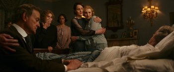 Movie still from “Downton Abbey: A New Era” (2022), directed by Simon Curtis – A group of people standing in a room; Medium shot, High angle
