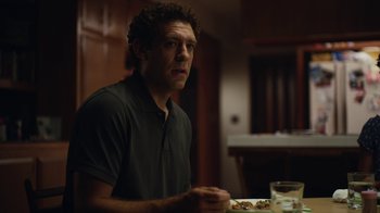 Movie still from “Euphoria” (2019), created by Sam Levinson – A man sitting at a table with food in front of him; Close Up shot, Over the shoulder angle