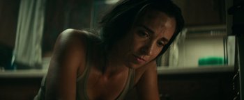 Movie still from “12 Strong” (2018), directed by Nicolai Fuglsig – A person sitting on the ground; Close Up shot, Low angle