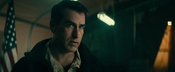 Movie still from “12 Strong” (2018), directed by Nicolai Fuglsig – A person wearing a jacket; Close Up shot, Over the shoulder angle