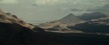 Movie still from “12 Strong” (2018), directed by Nicolai Fuglsig – A view of a mountain range from a distance; Extreme Wide shot, High angle