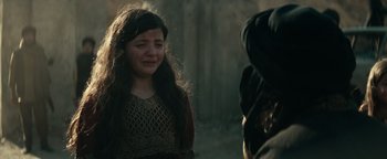 Movie still from “12 Strong” (2018), directed by Nicolai Fuglsig – A young girl is crying in front of another girl; Close Up shot, Over the shoulder angle