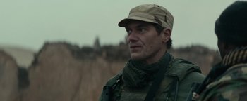 Movie still from “12 Strong” (2018), directed by Nicolai Fuglsig – A person wearing a hat; Close Up shot, Low angle