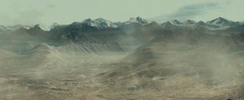 Movie still from “12 Strong” (2018), directed by Nicolai Fuglsig – A view of a mountain range in the distance; Extreme Wide shot, High angle