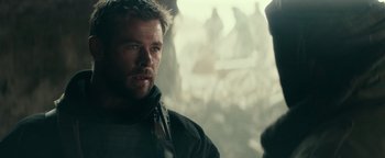 Movie still from “12 Strong” (2018), directed by Nicolai Fuglsig – A person wearing a jacket; Close Up shot, Over the shoulder angle
