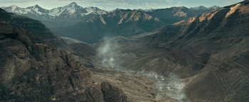 Movie still from “12 Strong” (2018), directed by Nicolai Fuglsig – A view of a mountain range from above; Extreme Wide shot, High angle