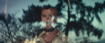 Movie still from “12 Strong” (2018), directed by Nicolai Fuglsig – A person looking through a window; Close Up shot, Over the shoulder angle