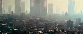 Movie still from “Dredd” (2012), directed by Pete Travis – An aerial view of a large city in the middle of the day; Extreme Wide shot, High angle