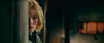 Movie still from “Dredd” (2012), directed by Pete Travis – A person wearing a leather jacket; Close Up shot, Over the shoulder angle