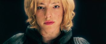 Movie still from “Dredd” (2012), directed by Pete Travis – A person with short blonde hair; Close Up shot, Low angle