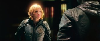 Movie still from “Dredd” (2012), directed by Pete Travis – A woman in a leather jacket looking at a man in a leather jacket; Close Up shot, Over the shoulder angle