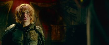 Movie still from “Dredd” (2012), directed by Pete Travis – A statue of a man in a suit; Close Up shot, Low angle