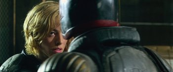Movie still from “Dredd” (2012), directed by Pete Travis – A person with a helmet on; Close Up shot, Over the shoulder angle
