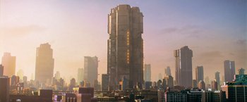 Movie still from “Dredd” (2012), directed by Pete Travis – A tall building in the middle of a large city; Extreme Wide shot, Low angle