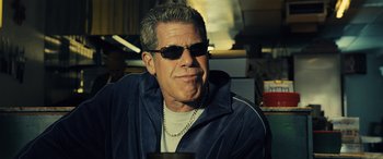 Movie still from “Drive” (2011), directed by Nicolas Winding Refn – A person wearing sunglasses and a jacket; Close Up shot, Low angle