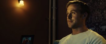Movie still from “Drive” (2011), directed by Nicolas Winding Refn – A man sitting in front of a computer monitor; Close Up shot, Over the shoulder angle