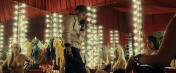 Movie still from “Drive” (2011), directed by Nicolas Winding Refn – A man and a woman in front of a mirror in a dressing room; Medium shot, Over the shoulder angle