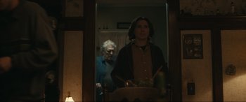 Movie still from “Dumb Money” (2023), directed by Craig Gillespie – A man standing in front of a bathroom mirror; Medium shot, Over the shoulder angle