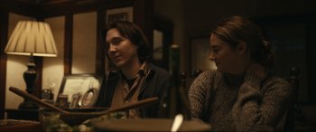 Movie still from “Dumb Money” (2023), directed by Craig Gillespie – A man and a woman sitting at a dinner table; Close Up shot, Over the shoulder angle