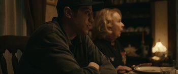 Movie still from “Dumb Money” (2023), directed by Craig Gillespie – A man and a woman sitting next to each other; Close Up shot, Over the shoulder angle