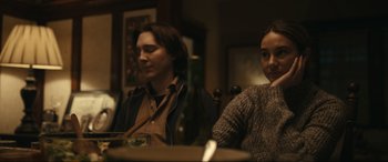 Movie still from “Dumb Money” (2023), directed by Craig Gillespie – A man and a woman sitting at a dinner table; Close Up shot, Over the shoulder angle