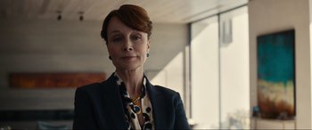 Movie still from “Dumb Money” (2023), directed by Craig Gillespie – A person wearing a suit and tie; Close Up shot, Low angle