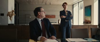 Movie still from “Dumb Money” (2023), directed by Craig Gillespie – A man and a woman standing in front of each other; Medium shot, Low angle