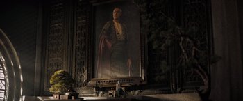 Movie still from “Dune” (2021), directed by Denis Villeneuve – A painting of an old man with a cane; Medium shot, Low angle