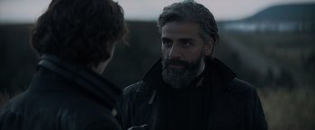 Movie still from “Dune” (2021), directed by Denis Villeneuve – A man with a beard talking to another man; Close Up shot, Over the shoulder angle