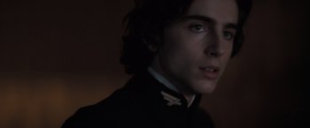 Movie still from “Dune” (2021), directed by Denis Villeneuve – A person wearing a jacket; Close Up shot, Over the shoulder angle