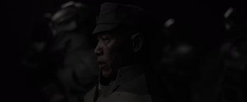 Movie still from “Dune” (2021), directed by Denis Villeneuve – A man wearing a uniform and a hat; Close Up shot, Low angle