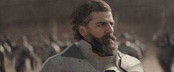 Movie still from “Dune” (2021), directed by Denis Villeneuve – A man with a long beard and a mustache; Close Up shot, Low angle