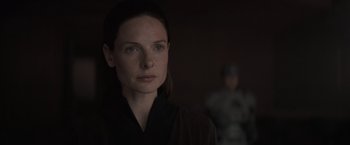 Movie still from “Dune” (2021), directed by Denis Villeneuve – A woman in a black shirt is looking at the camera; Close Up shot, Over the shoulder angle