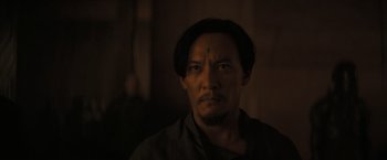 Movie still from “Dune” (2021), directed by Denis Villeneuve – A person with a cross on his forehead; Close Up shot, Over the shoulder angle