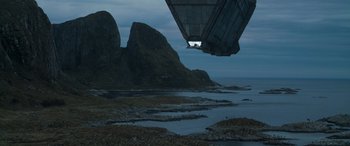 Movie still from “Dune” (2021), directed by Denis Villeneuve – A view of some rocks and a body of water from under a bridge; Extreme Wide shot, Low angle