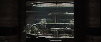 Movie still from “Dune” (2021), directed by Denis Villeneuve – A room filled with lots of plants on top of a table; Wide shot, High angle